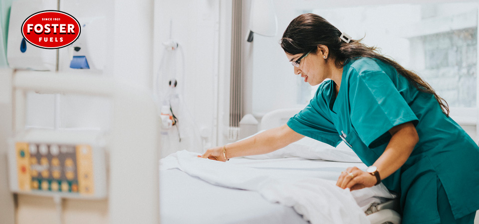 Nurse making a patient's bed