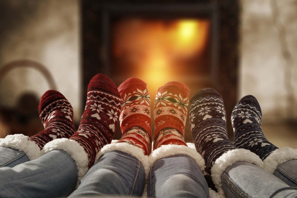 Cozy socks and a warm fireplace on a fall evening